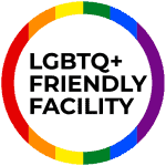 LGBTQ+ Friendly Facility logo featuring bold text in the center surrounded by a rainbow-colored circular border, symbolizing inclusivity and support. This logo signifies Key Healthcare's commitment to providing a safe, welcoming, and affirming environment for LGBTQ+ adolescents in their mental health and recovery programs.
